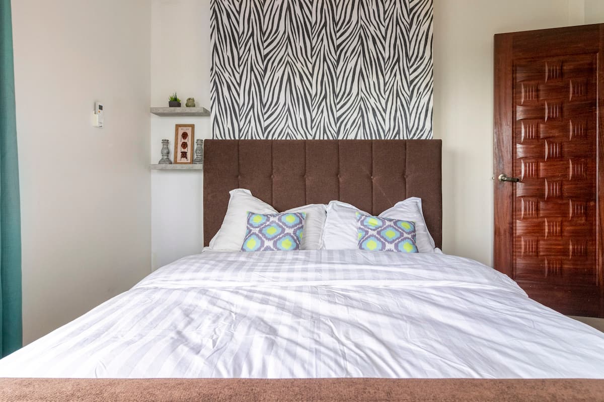 Bedroom three with a queen bed